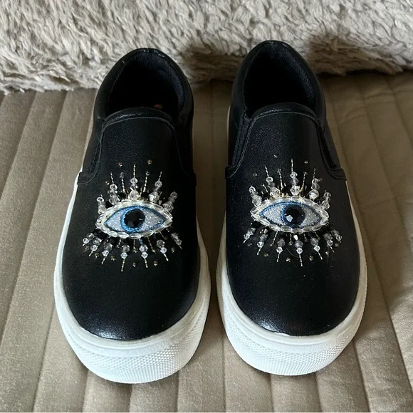 Kurt Geiger Kids Black Slip-On Shoes with Eye Design - Picture 1 of 7